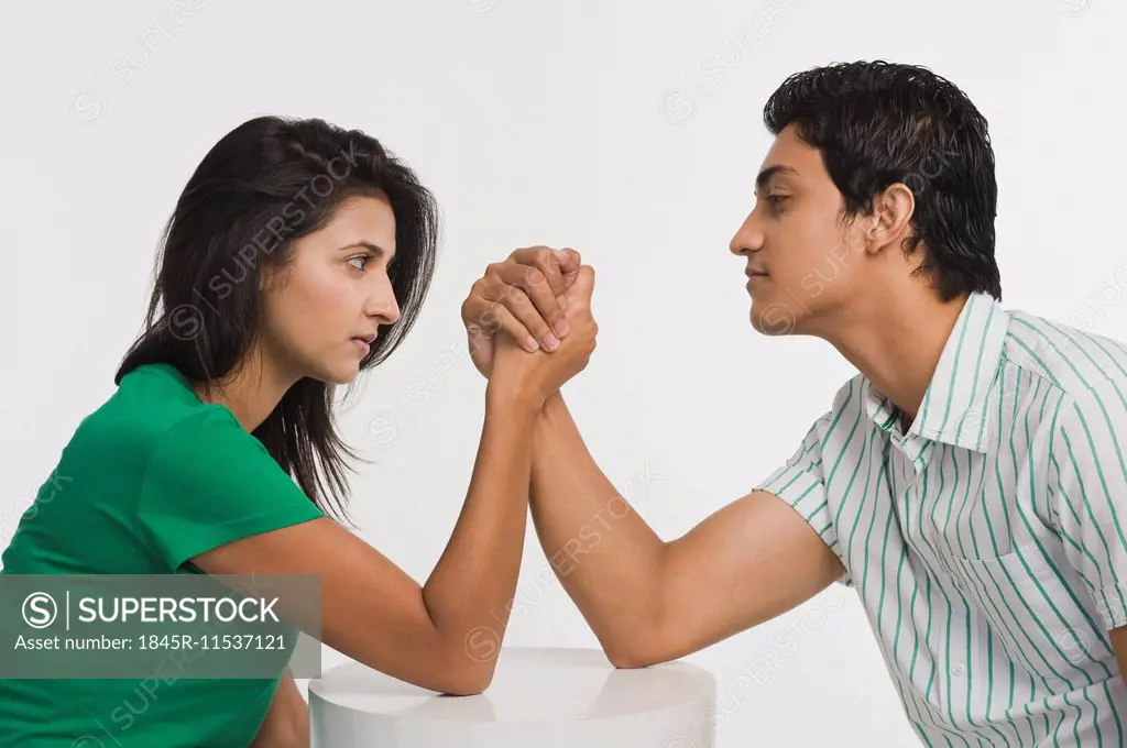 Couple arm wrestling