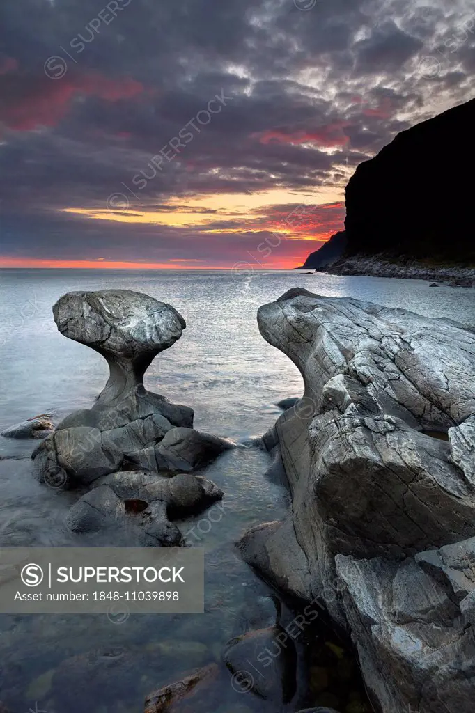 Kannestein or Kanne Stone with coastline at sunset, Vågsøy island, Sogn og Fjordane, Norway