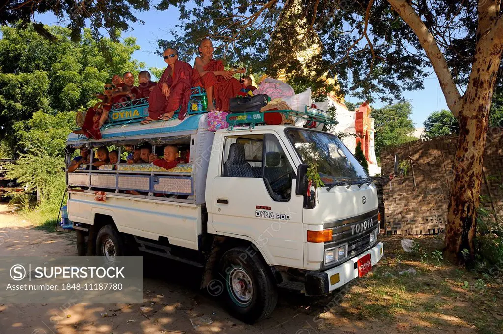 Buddhist child monks taking the school bus, Bagan, Mandalay Division, Myanmar