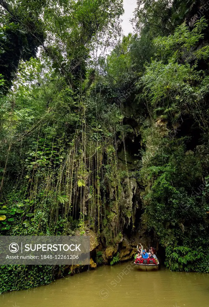 Exit of the cave system, tourists in an electric boat, caves of the Indios, Cueva del Indio, underground caves with a river, Viñales, Cuba