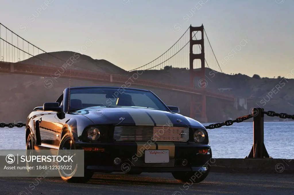 Remake of the legendary Ford Mustang Shelby GT-H (convertible) in front of the Golden Gate Bridge at Sunset, San Francisco, California, USA