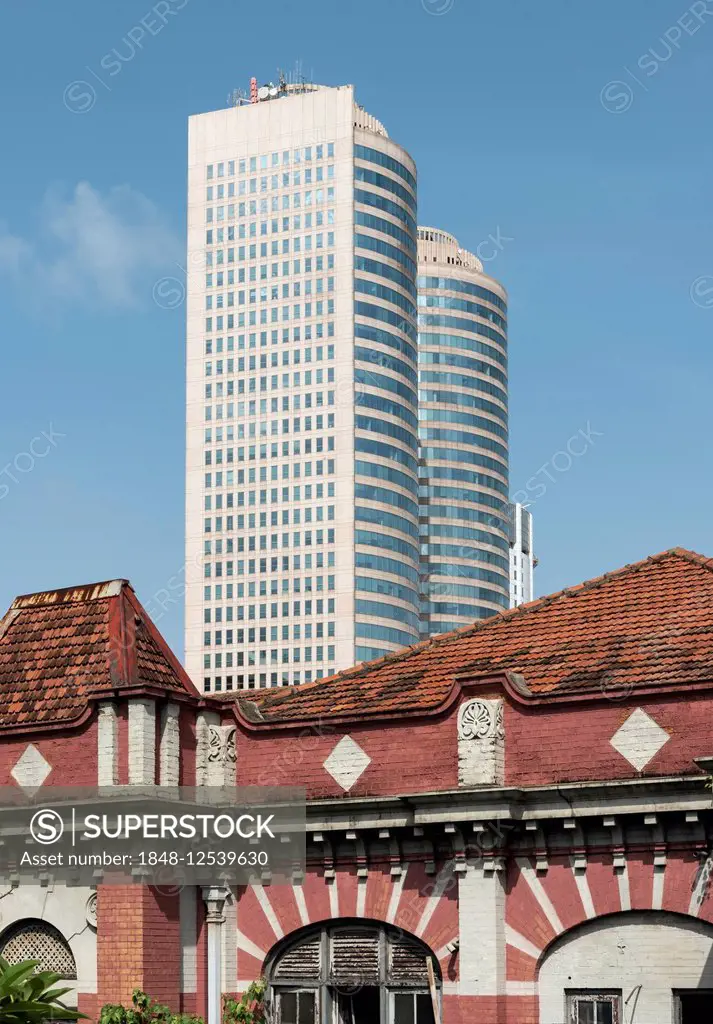 Towers of World Trade Center and abandoned colonial house, Colombo, Sri Lanka