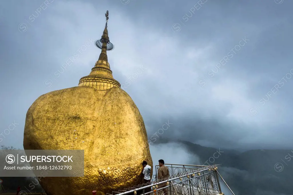 Praying believer, Golden Rock, Kyaiktiyo Pagoda, fog, Kyaikto, Thaton District, Mon State, Myanmar