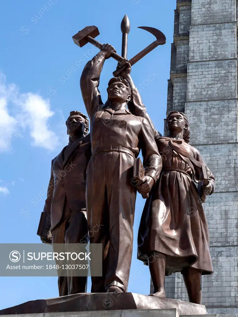 Sculptural group with hammer and sickle, part of a Juche Tower, in front of the Juche Tower, Pyongyang, North Korea