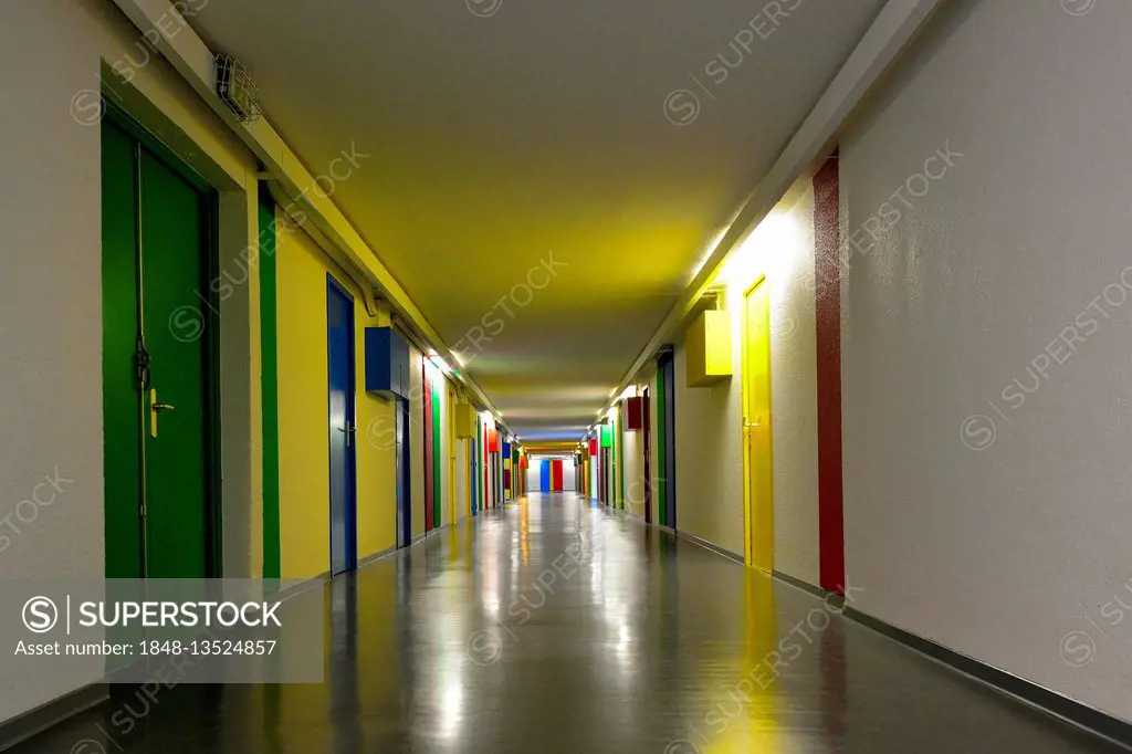 Hallway with colorful doors, Unité d'habitation de Briey, designed by Le Corbusier, modernist residential housing, UNESCO World Heritage Site, Briey, ...