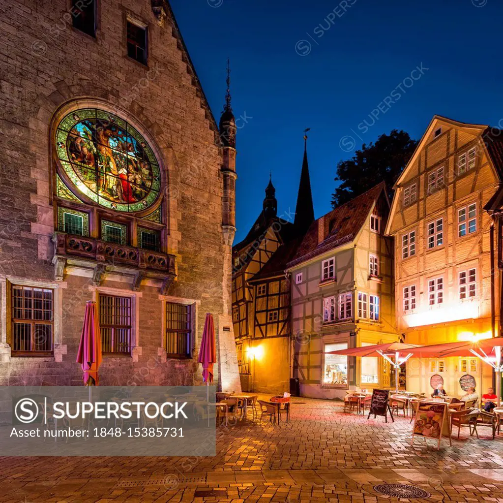 Window with enlightened stained glass at the town hall, half-timbered houses, night scene, UNESCO World Heritage Site, Quedlinburg, Harz, Saxony-Anhal...