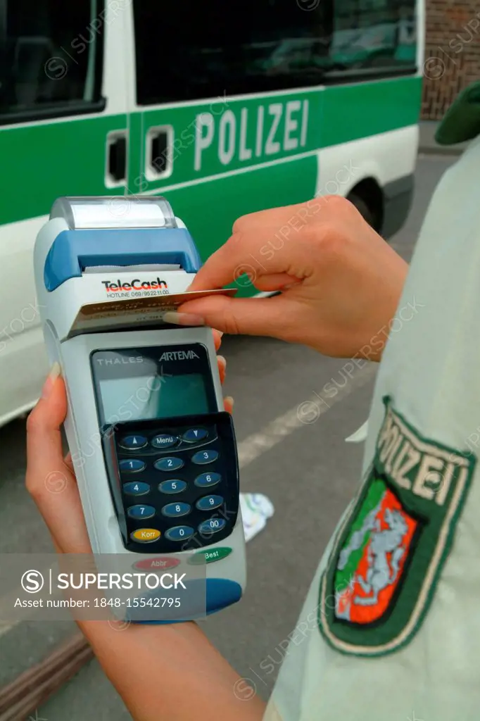 DEU, Germany, Duisburg: creditcard payment for speeding or other police tickets. Driver or other people who have to pay a ticket can do this now witho...