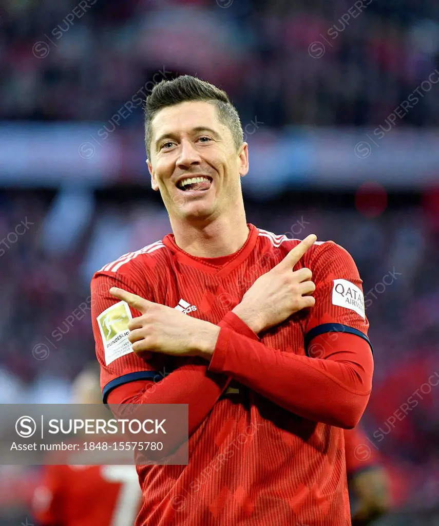 Typical goal celebration with crossed arms and outstretched tongue, Robert Lewandowski, FC Bayern Munich FCB, Allianz Arena, Munich, Bayern, Germany