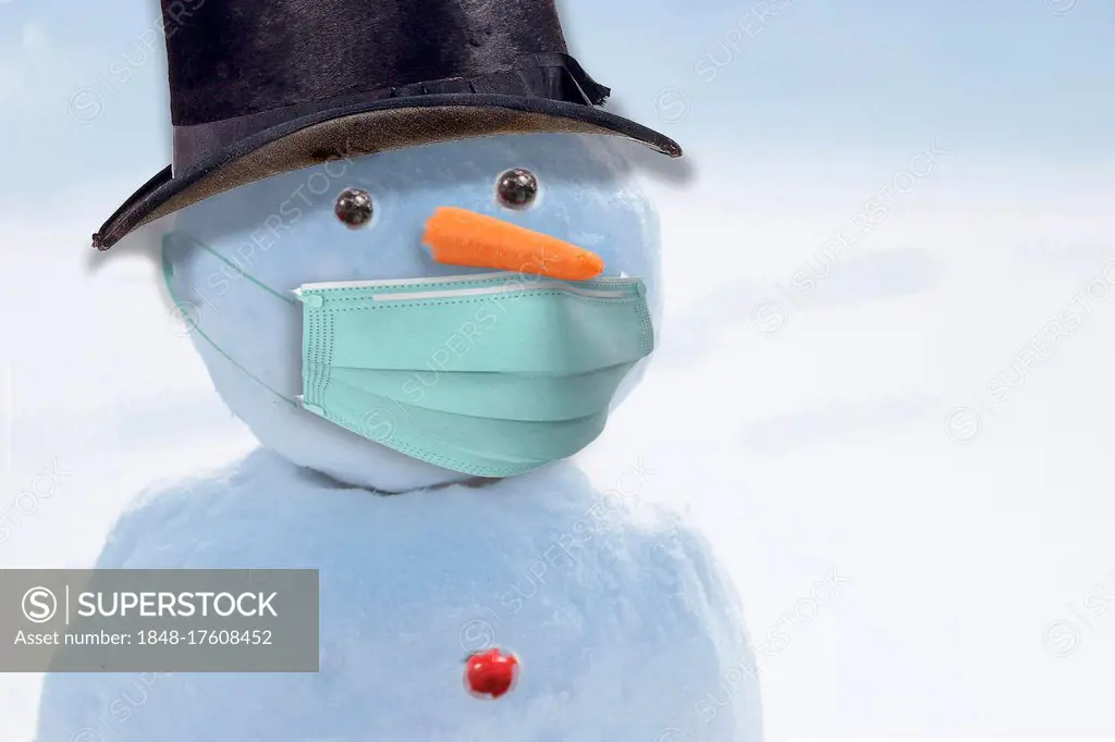 Snowman with breathing mask because of corona epidemic