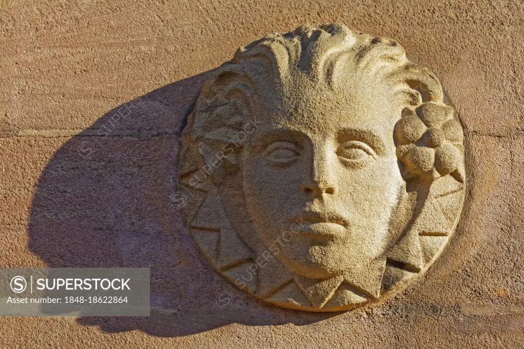 Relief, sculpture, head, face, allegory, emblem, symbol, allegory, representation of the season spring, spring on house wall, facade, Nuremberg, Middl...