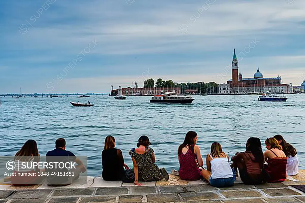 Tourists on quay wall, Venice, Italy, Europe