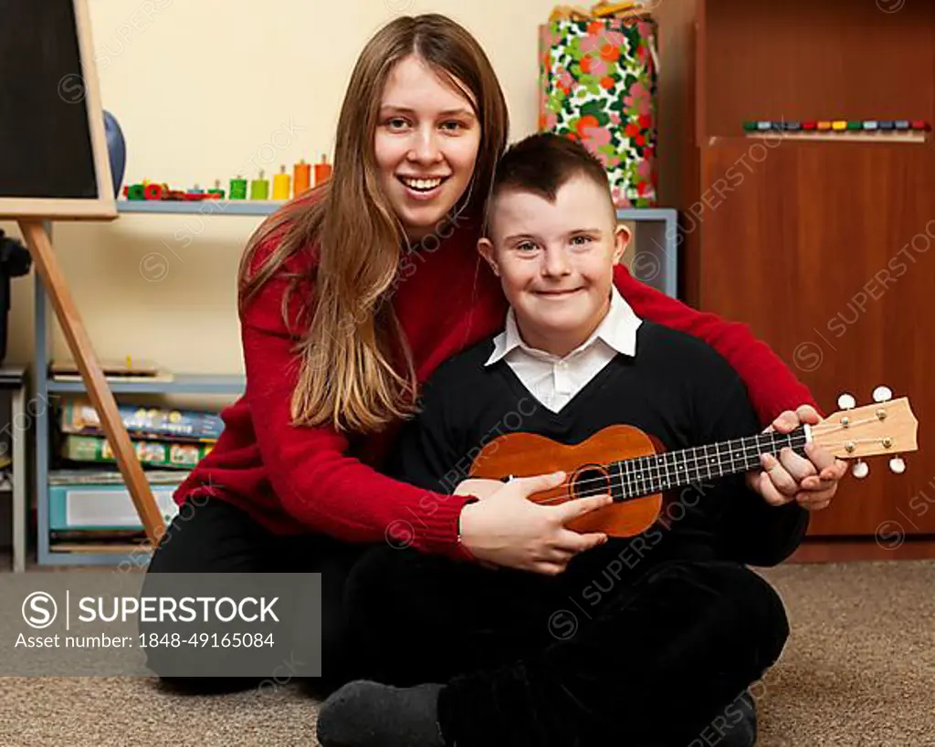 Woman boy with down syndrome posing