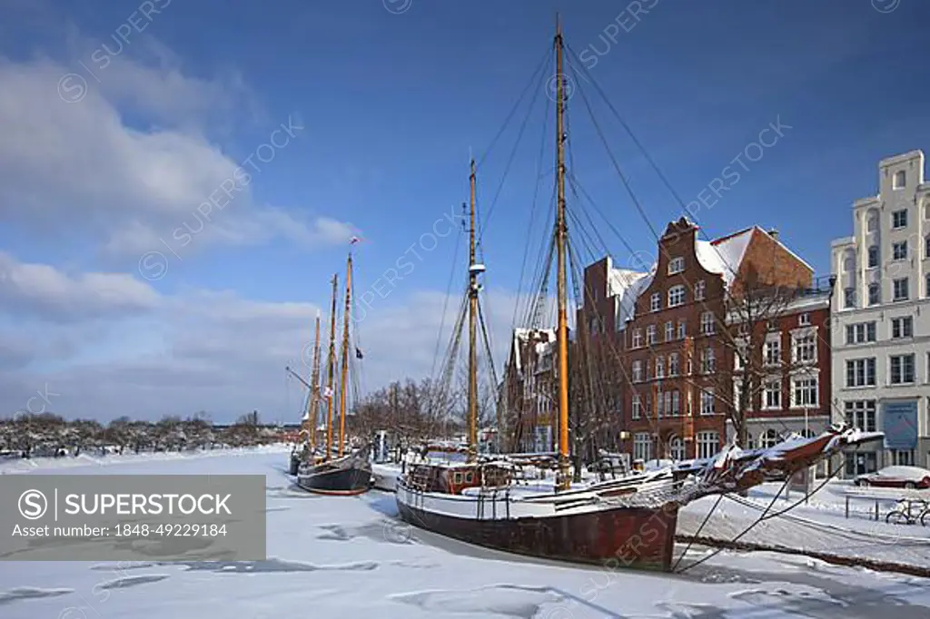 Sailing ship in the snow in winter in the harbour museum at the Hanseatic City of Luebeck, Obertrave, Germany, Europe