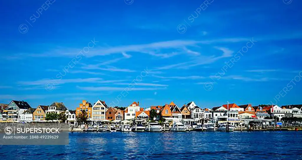 Front row commercial buildings and gastronomy in Travemuende on the river Trave. Hanseatic City of Luebeck. Schleswig-Holstein. Germany