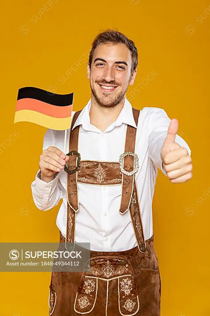 Front view man holding german flag