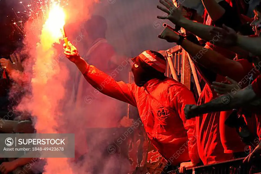 BayArena Leverkusen, 18.5.2023 Football Europa League semi-final second leg Bayer 04 Leverkusen (B04) (red) vs AS Roma (ASR) (white) - Leverkusen fan with pyro flare UEFA REGULATES PROHIBIT ANY USE OF PHOTOGRAPHS AS IMAGE SEQUENCES AND OR QUASI-VIDEO