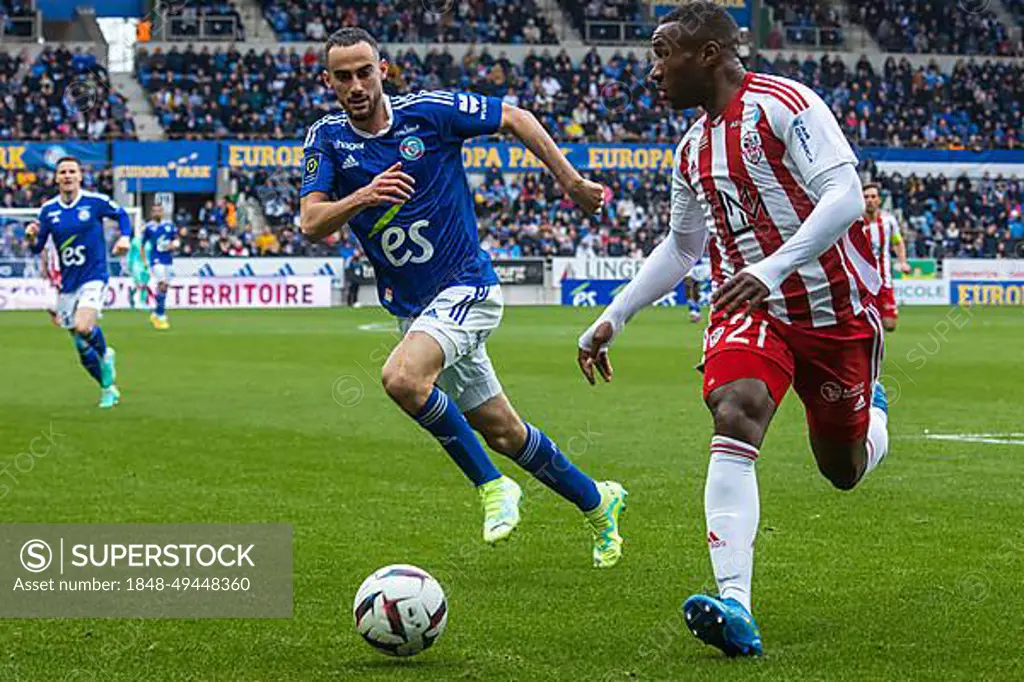 Lucas PERRIN (Racing Strasbourg) in a duel with Cedric AVINEL (Ajaccio)