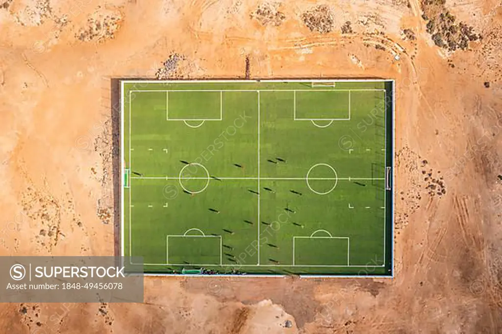 Sports field with players in the middle of the desert on Sal, Cape Verde Islands