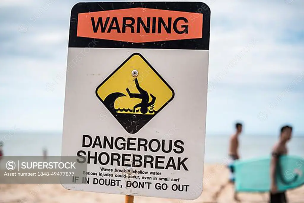 A dangerous shorebreak sign at the beach in the north shore of Oahu, Hawaii, United States, North America