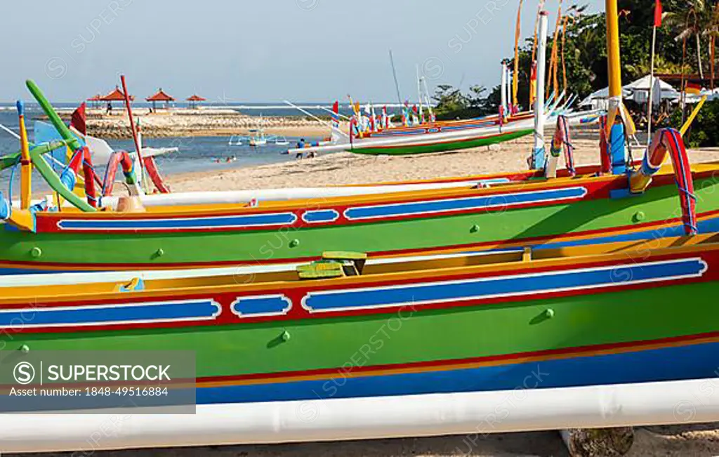 Brightly painted fishing outriggers on the beach at Sanur, Bali, Indonesia,  Asia - SuperStock