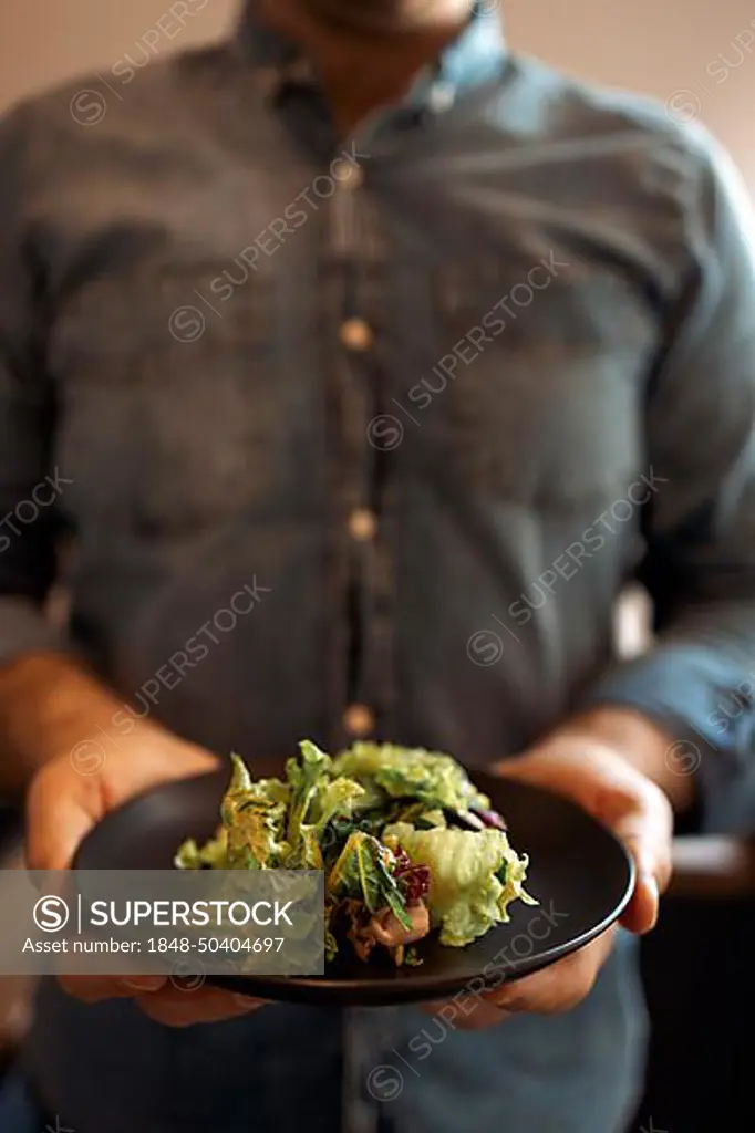 Healthy Lifestyle. Man Cooking Green Salad Of Romaine Lettuce. Healthy Food concept