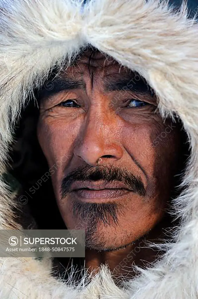 Portrait of Inuit hunter with a fur hat, Igloolik, Foxe Basin, Nunavut, Canada, North America