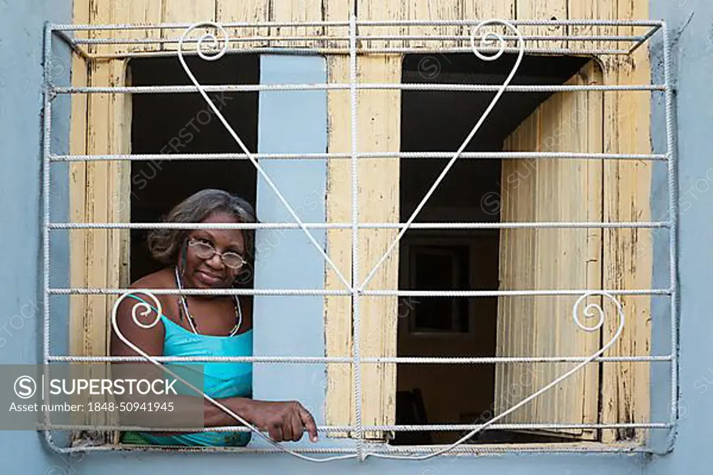 Woman at window, Santiago de Cuba, Cuba, Central America