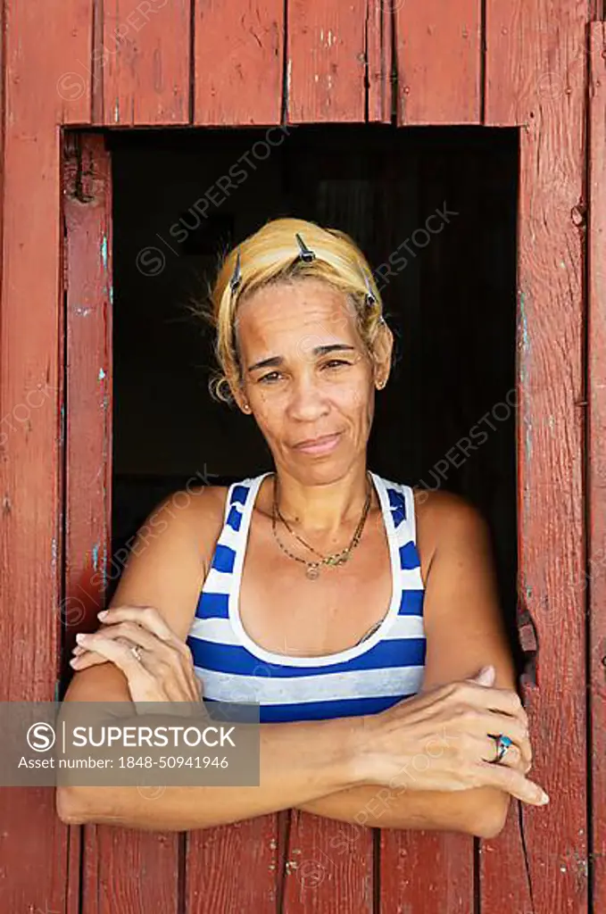 Woman at window, Santiago de Cuba, Cuba, Central America