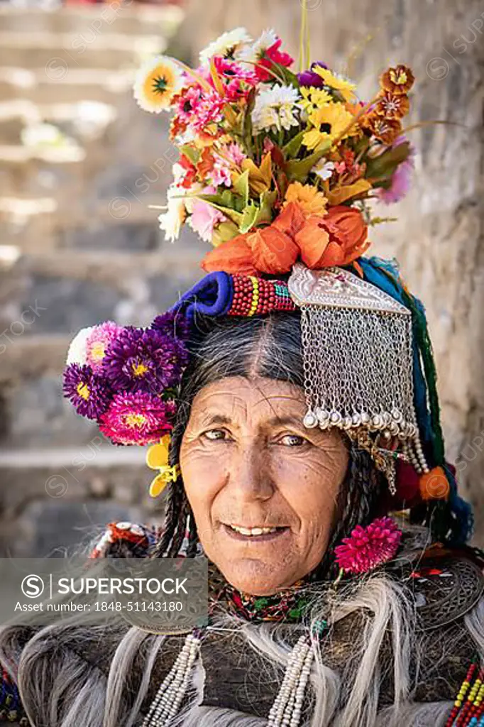 Ladakh, India, August 29, 2018: Portrait of an indigenous elderly woman with traditional flower hat in Ladakh, India. Illustrative editorial, Asia