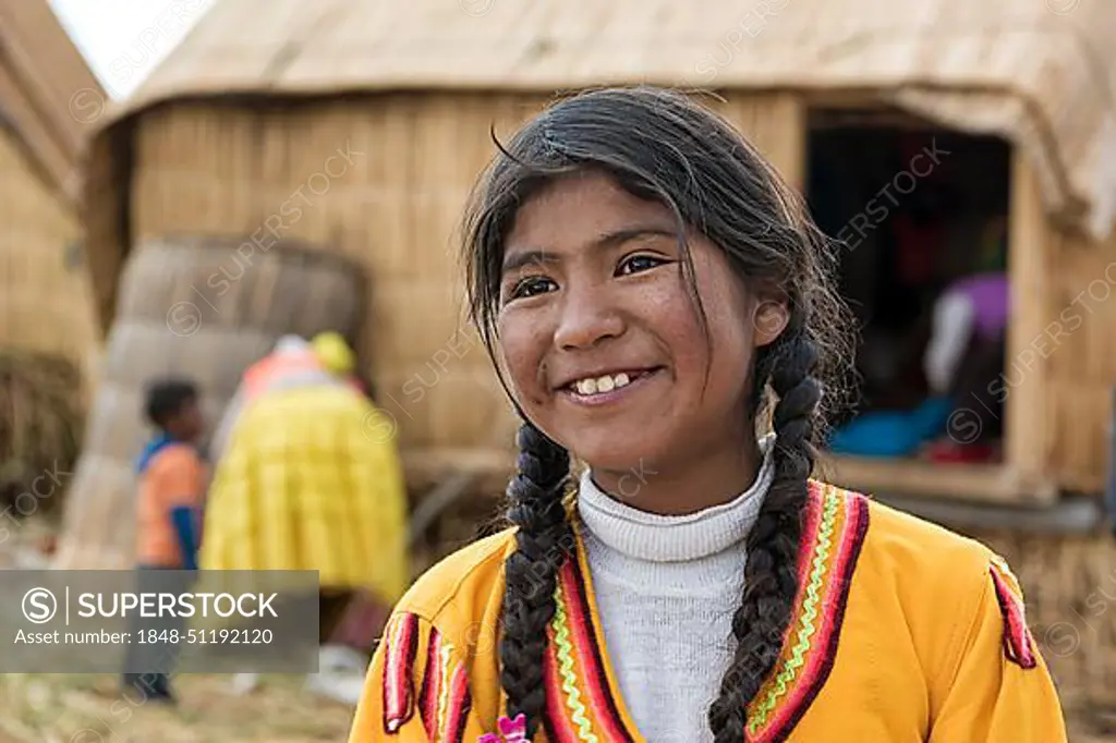 Local girl laughs, portrait, tribe of the Urus, Lake Titicaca, Puno region, Peru, South America