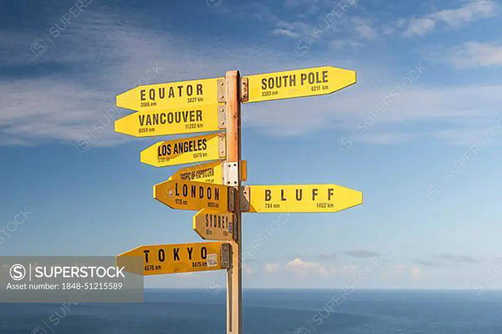 Yellow signs, signposts with various travel destinations, Cape Reinga, North Island, New Zealand, Oceania