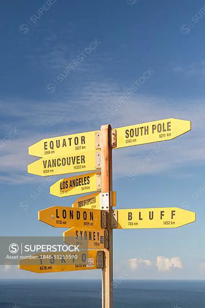 Yellow signs, signposts with various travel destinations, Cape Reinga, North Island, New Zealand, Oceania