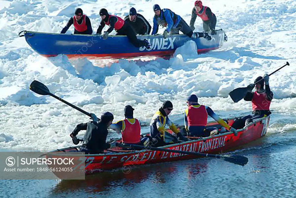 CAN, Canada , Quebec : Winter carnival in Quebec City, Canoe race over the partly frozen Saint Lawrence River, North America