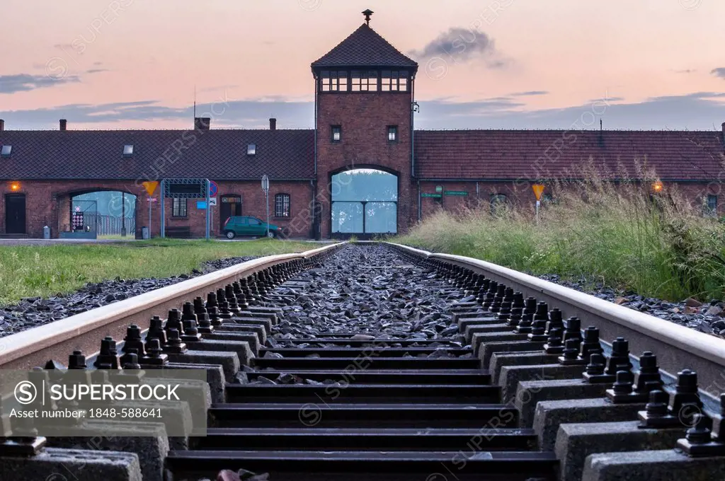 Rail tracks and entrance gate to the Auschwitz-Birkenau concentration camp, Auschwitz, Lesser Poland, Poland, Europe