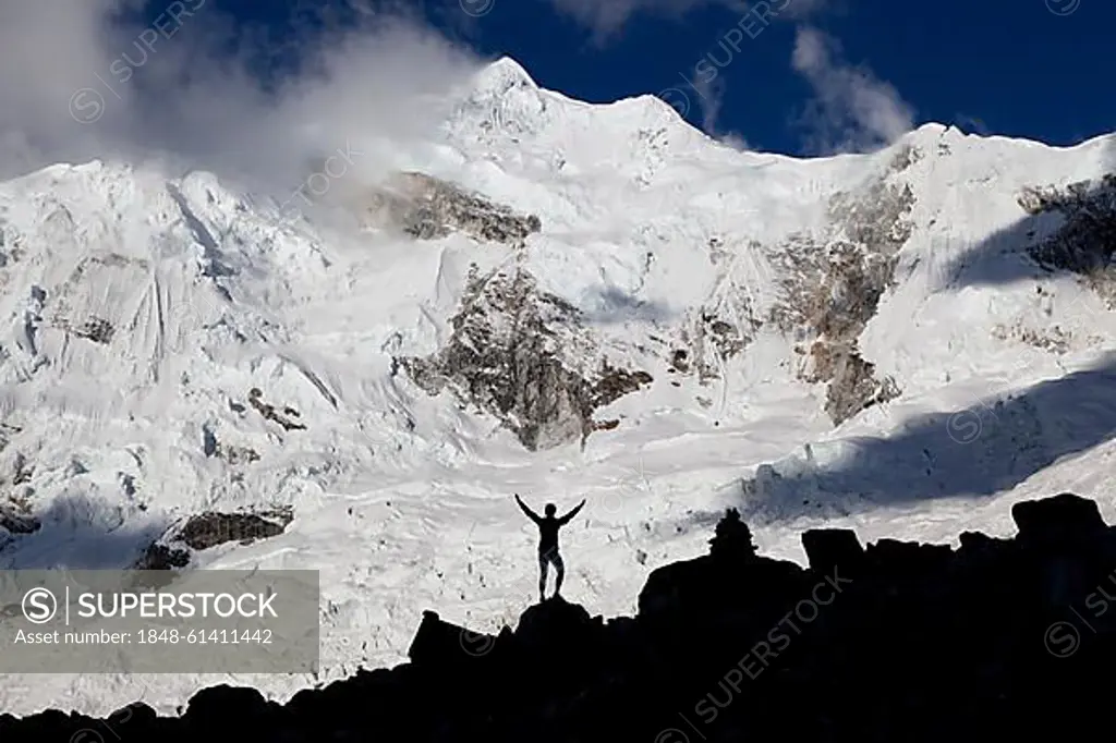 Silhouette of a woman standing in front of Nevado Chopicalqui mountain, Cordillera Blanca mountain range, Andes, Peru, South America