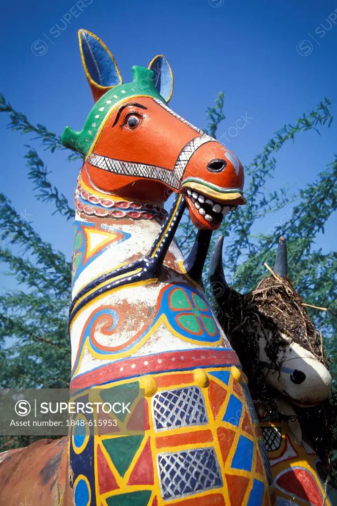 Horse made out of clay, painted red, near Karaikudi, Tamil Nadu, South India, India, Asia