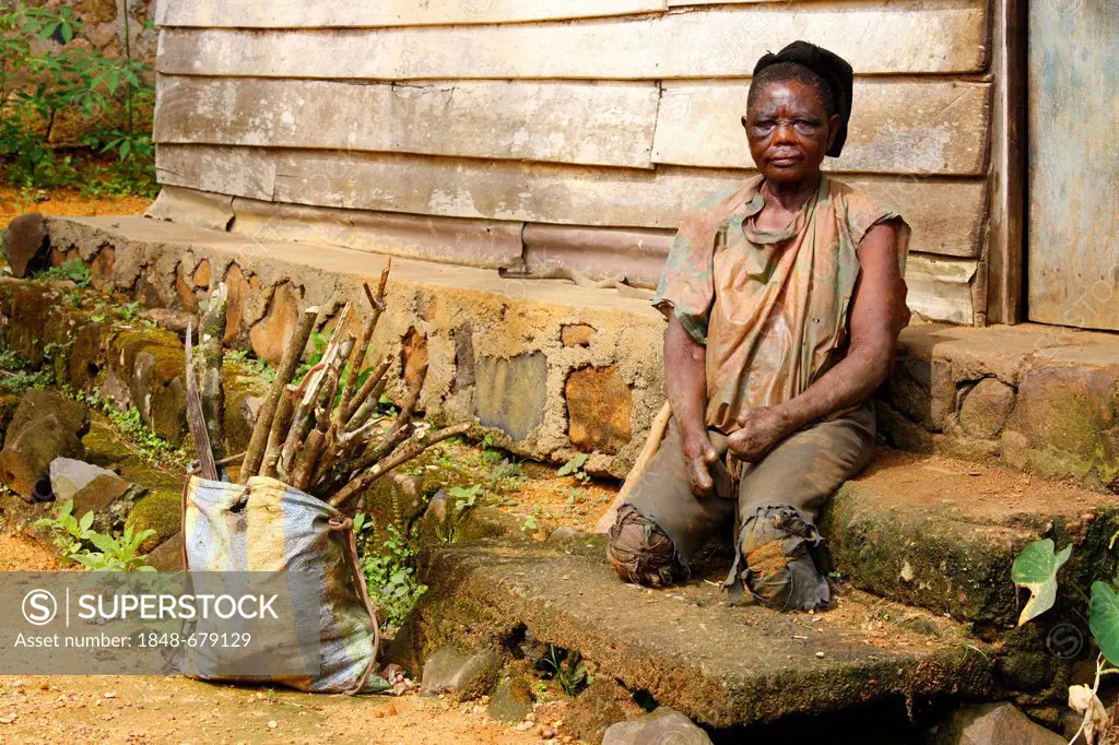 Leprous woman outside her house, tuberculosis and leprosy station, Manyemen, Cameroon, Africa