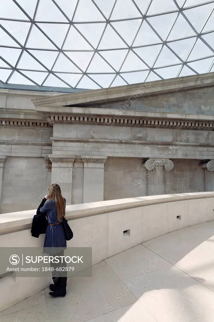 Young visitor waiting in the Great Court with a modern dome, British Museum, London, England, United Kingdom, Europe