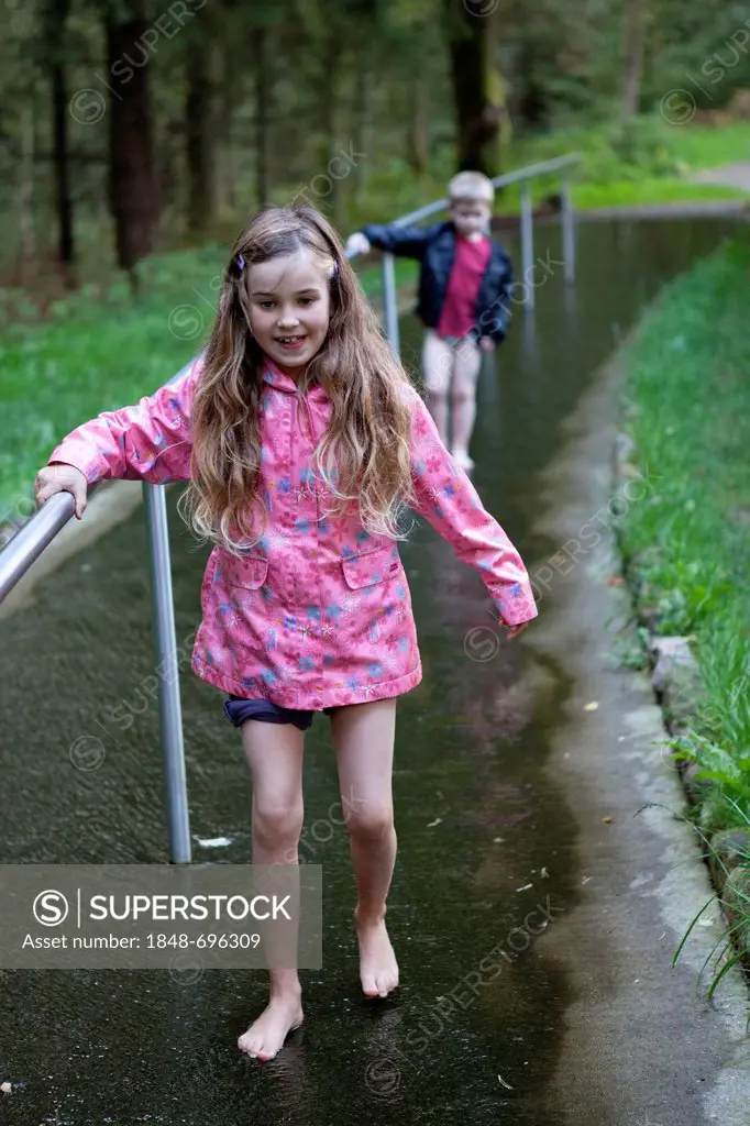 Children on barefoot trail, Barfusspark Egestorf, barefoot park, Luneburg Heath, Lower Saxony, Germany, Europe