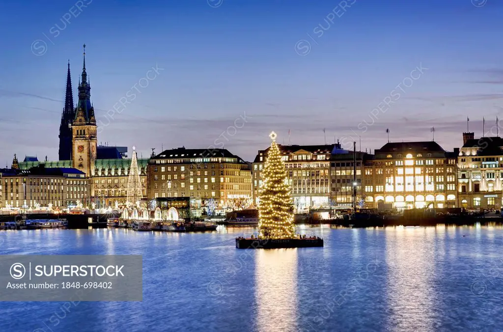 Binnenalster or Inner Alster Lake at Christmas time with Alster fir tree and city hall, Hamburg, Germany, Europe