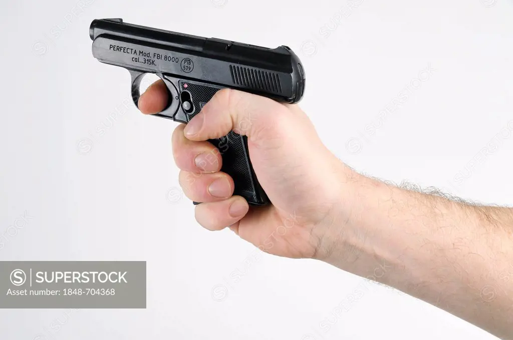 Hand holding a pistol