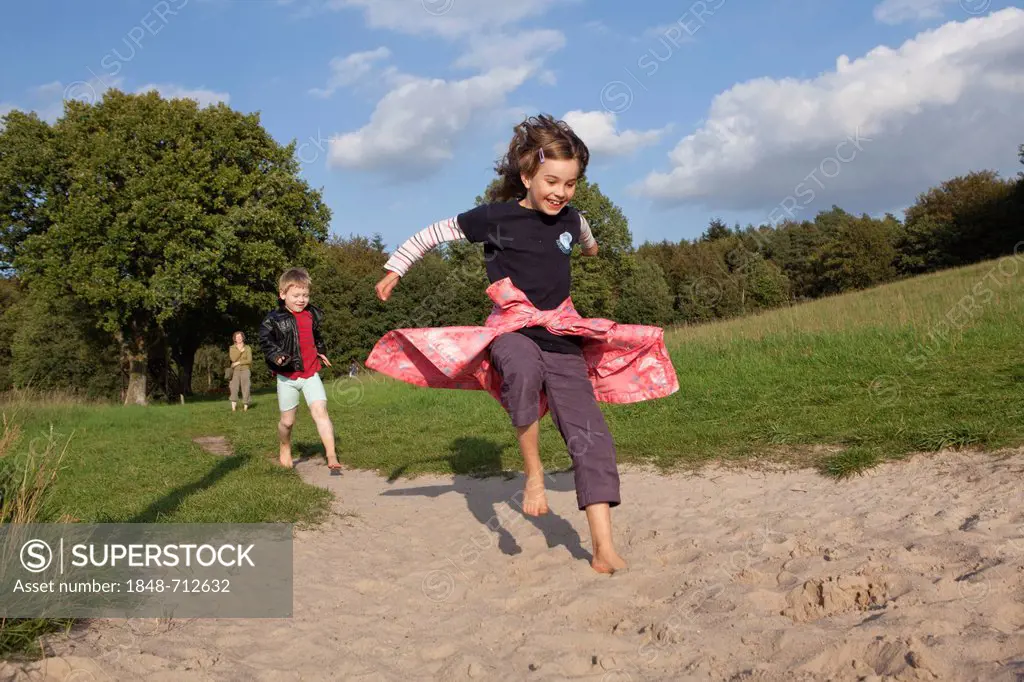 Children on barefoot trail, Barfusspark Egestorf, barefoot park, detail of children's feet, Luneburg Heath, Lower Saxony, Germany, Europe