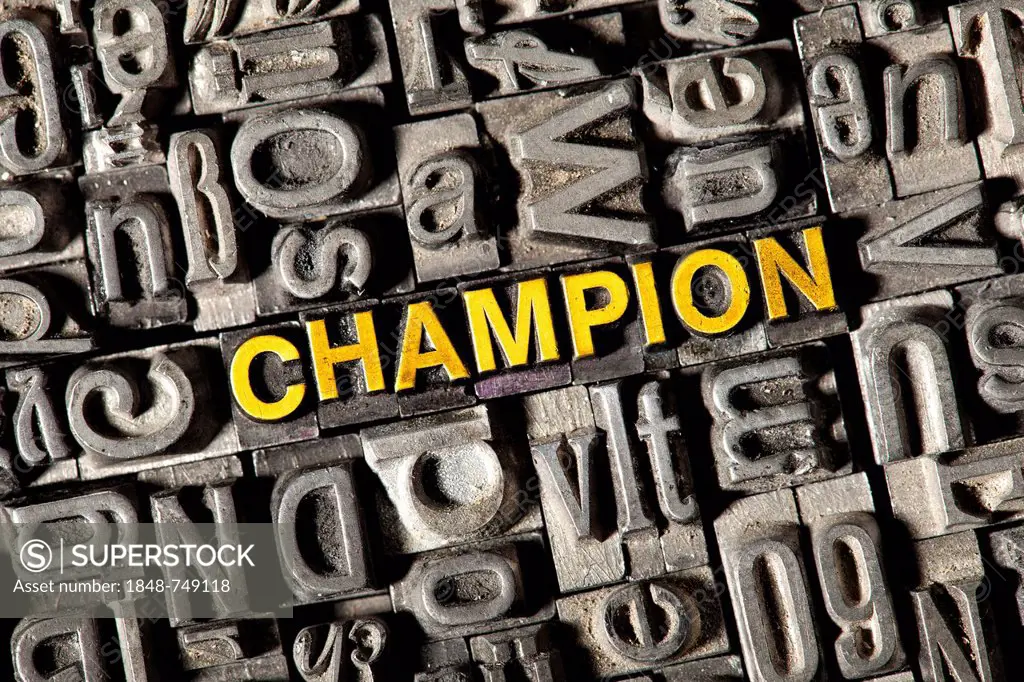 Old lead letters forming the word champion