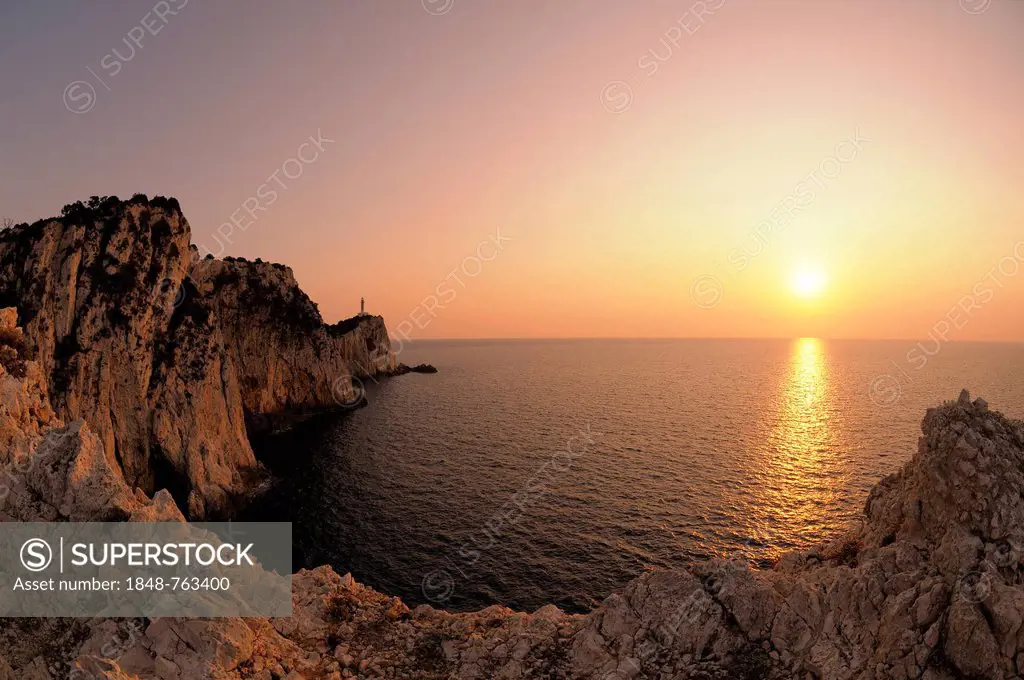 Sunset at cape with lighthouse, Lefkas or Lefkada, Greece, Europe