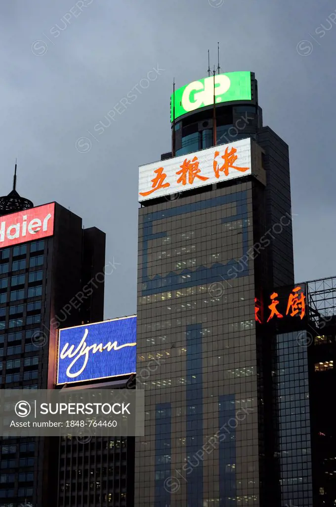 Skyscrapers and neon signs at dusk, Wan Chai, Hong Kong Island, Hong Kong, China, Asia