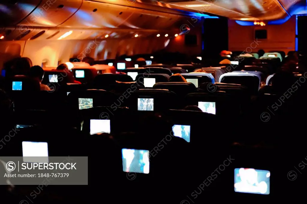 Boeing 777, Economy Class, inflight entertainment in the aircraft at night