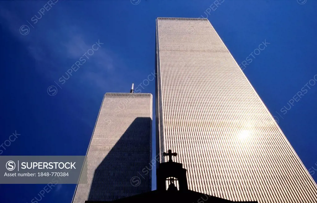 The St. Nicholas Greek Orthodox Church in front of the North and South Tower of the former World Trade Center or WTC, historical photograph. The churc...