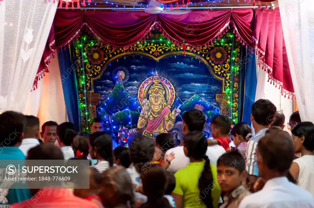 Worshipping Hindus, Hindu shrine with an image of the deity Saman in the Buddhist Mahiyangana Temple