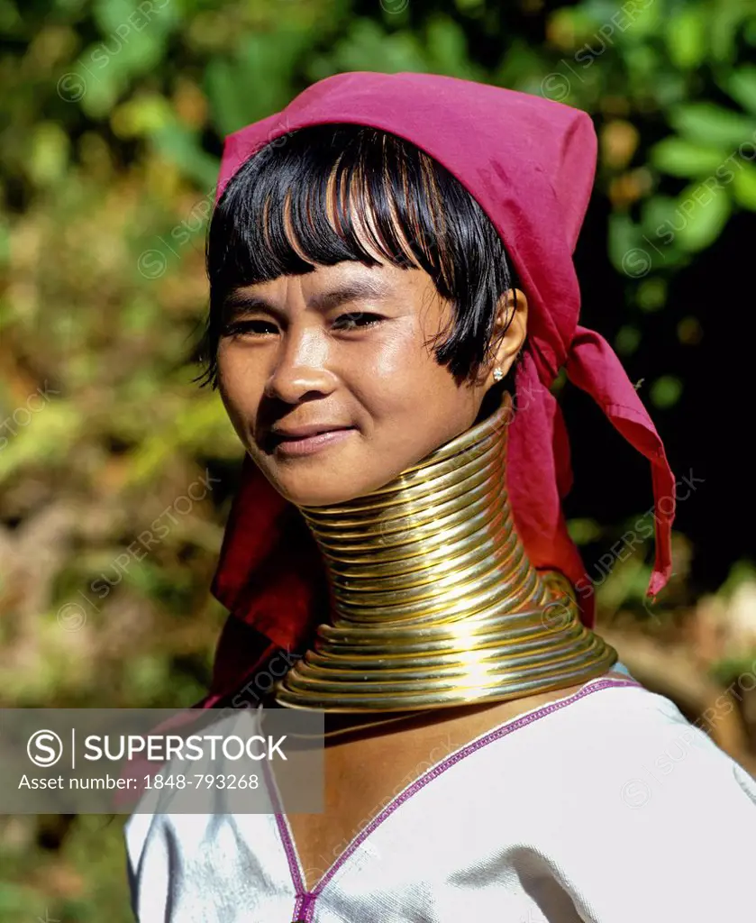 Long-necked woman of the Padaung mountain tribe, also known as giraffe women, wearing neck rings