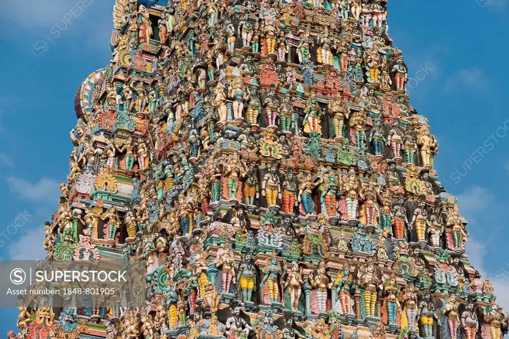 Colourful statues of gods and demons on the Gopuram or Gopura gate tower, Meenakshi Amman Temple or Sri Meenakshi Sundareswarar Temple, Madurai, Tamil...